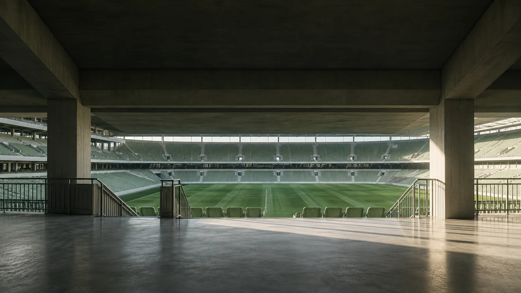 An empty stadium concourse opens onto the seating bowl before gates open.